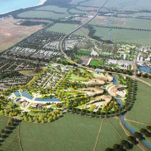 Vue aérienne en rendu 3D de Medine Smart City (Uniciti), avec campus, quartiers résidentiels, plans d'eau et champs
