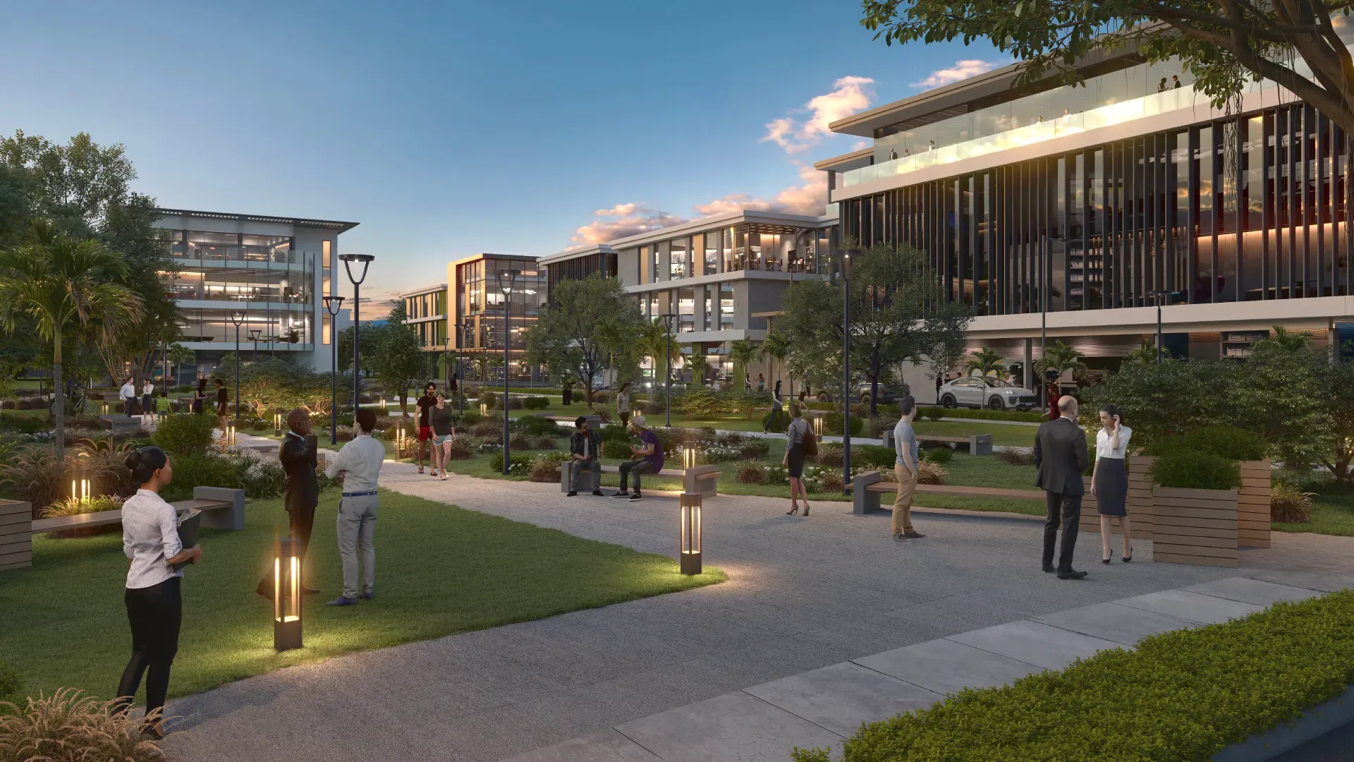 Dusk rendering of the Beau Plan Business District with office buildings around a landscaped plaza and people walking