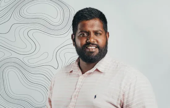 Kooghen Thungavelu, Land Survey Technician at Novaterra, smiling in a striped shirt beside a contour-line map pattern