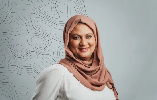 Warda Auckburally, Manager of Projects & Implementation at Novaterra, smiling in a pink hijab and white top